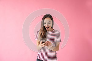 Surprised girl uses a cell phone