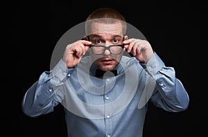 Surprised guy dresssed casually wearing spectacles