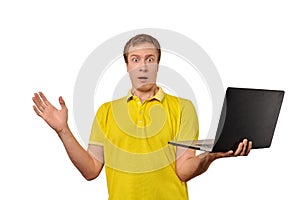 Surprised guy holding laptop in hand isolated on white background