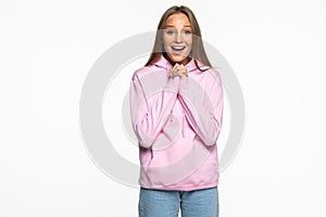 Surprised happy beautiful woman looking sideways in excitement isolated on white background