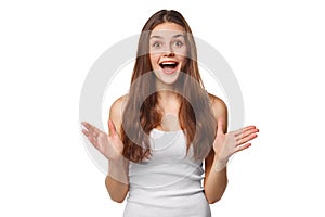 Surprised happy beautiful woman looking sideways in excitement. Isolated on white background