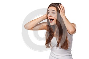 Surprised happy beautiful woman looking sideways in excitement, on white background