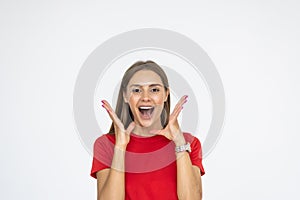 Surprised happy beautiful woman looking sideways in excitement on white background