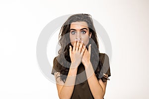 Surprised happy beautiful woman looking sideways in excitement on white background