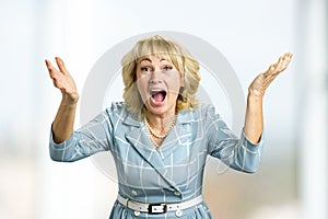 Surprised happy mature woman.