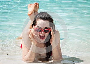 Surprised happy woman on beach