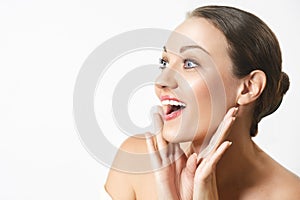 Surprised happy young woman looking sideways in excitement. photo