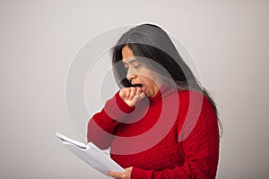 Surprised Hispanic Woman Looks At Notes