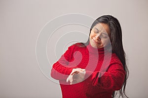 Surprised Hispanic Woman Looks At Wrist Watch