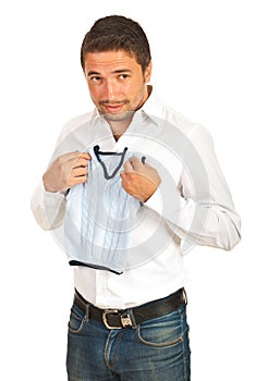 Surprised man holding shrunk vest