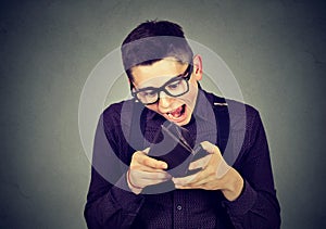 Surprised man looking at his wallet
