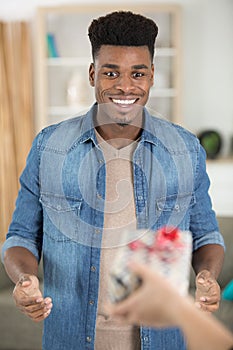 surprised man receiving gift