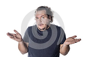 Surprised man throws up his hands in disbelief on white background