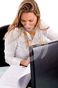 Surprised manager with document and bag