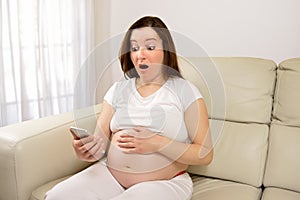 Surprised pregnant woman
