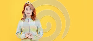 surprised redhead woman in queen crown with magic wand, magic. Woman  face portrait, banner with copy space.