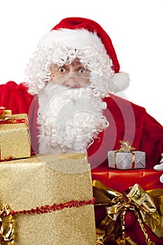 Surprised Santa Claus with Christmas gifts