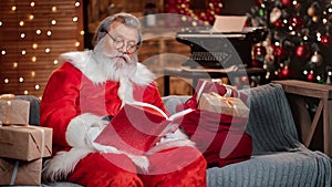 Surprised Santa Claus opening wishlist book reading wishes. Shot on RED Raven 4k Cinema Camera