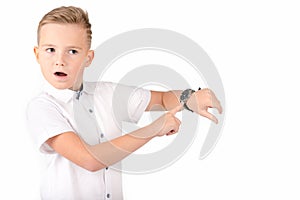 Surprised schoolboy with wach, isolated on white