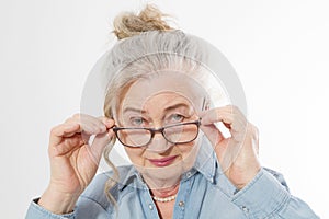 Surprised and shock Senior woman with wrinkle face and eye care glasses isolated on white background. Mature healthy lady. Copy