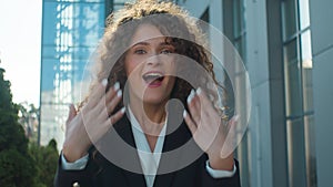Surprised shocked amazed business woman portrait in city caucasian happy girl excited positive emotional female