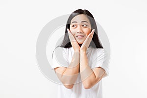 Surprised shocked excited asian woman face isolated on white background. Young asian girl in summer t shirt. Copy space.