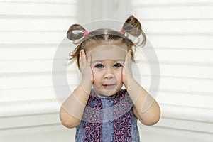 Surprised or shocked face of 4 years old pretty caucasian child girl