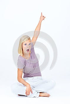 Surprised, shocked and portrait of a woman pointing isolated on a white background in studio. Wow, wtf and amazed face