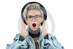 Surprised and shocked woman with opened mouth standing with open palms on white background