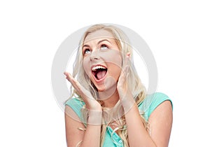 Surprised smiling young woman or teenage girl