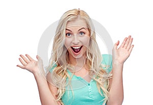 Surprised smiling young woman or teenage girl