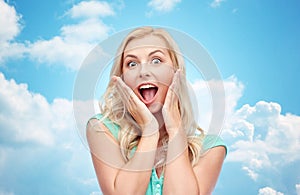 Surprised smiling young woman or teenage girl