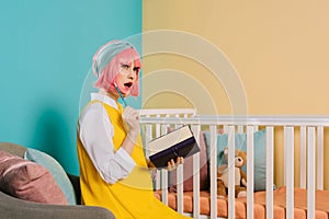 surprised stylish pregnant pin up woman photo