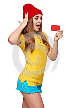 Surprised teen funky girl with credit card