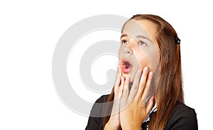 Surprised teen girl covering her mouth with hands