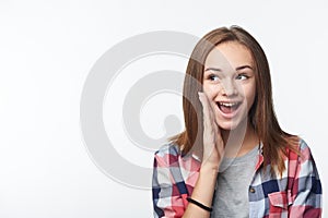 Surprised teen girl looking to the side