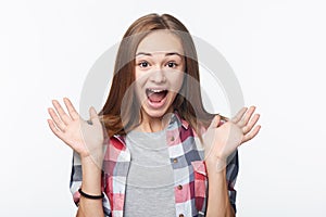 Surprised teen girl screaming looking at camera