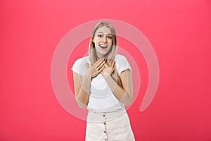 Surprised teenage student girl show shocking expression with something. on Bright Pink Background. Copy space