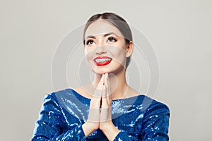 Surprised woman with braces on teeth on white background portrait