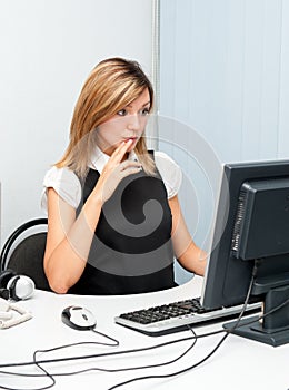 Surprised woman at computer