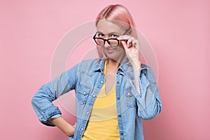 Surprised woman in disbelief taking off or on glasses.