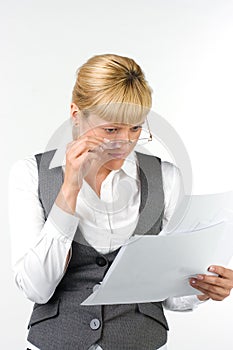 Surprised woman in glasses with documents