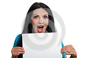 Surprised woman holding a blank page