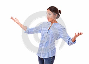 Surprised woman holding up her hands