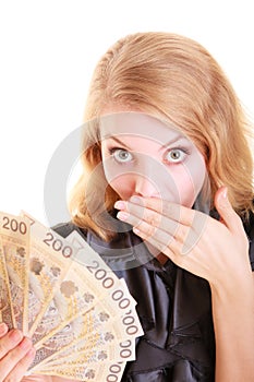 Surprised woman holds polish currency money banknote.