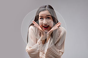 Surprised woman, joyous expression, gesturing secrets