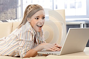 Surprised woman with laptop