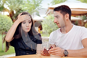Surprised Woman Receiving Engagement Ring from Man