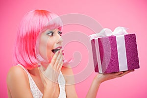 Surprised woman receiving gift