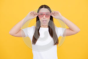 Surprised woman, shocking girl wearing funny glasses on isolated yellow background, Wow face feelings with copy space